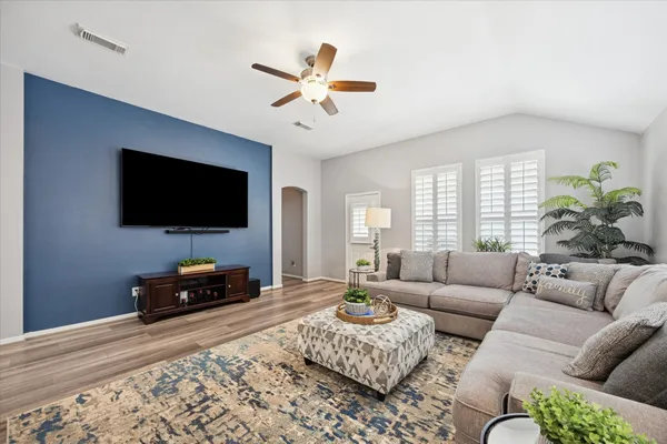 a living room with furniture and a flat screen tv