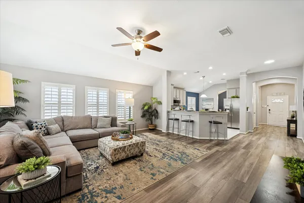 a living room with furniture and a large window