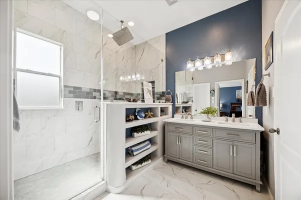 a large kitchen with a lot of counter space and sink