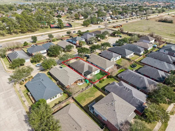 an aerial view of a house with swimming pool