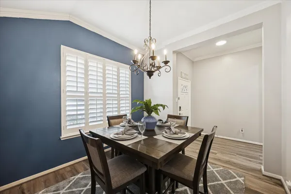 a view of a dining room with furniture and window