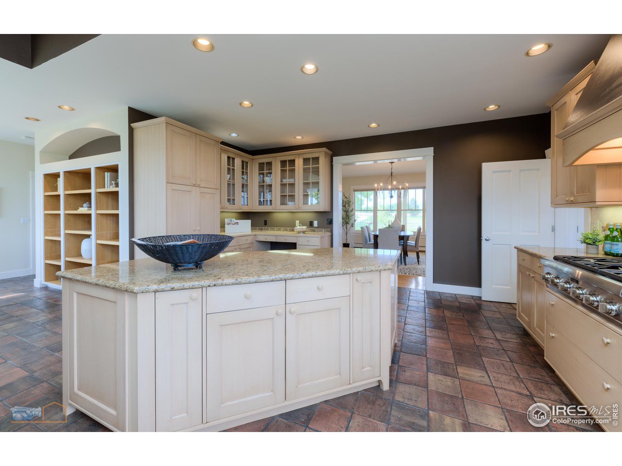 8524 Valmont Road Boulder, CO 80301 - Photo 23 of 40 a kitchen with stainless steel appliances kitchen island granite countertop a sink and cabinets