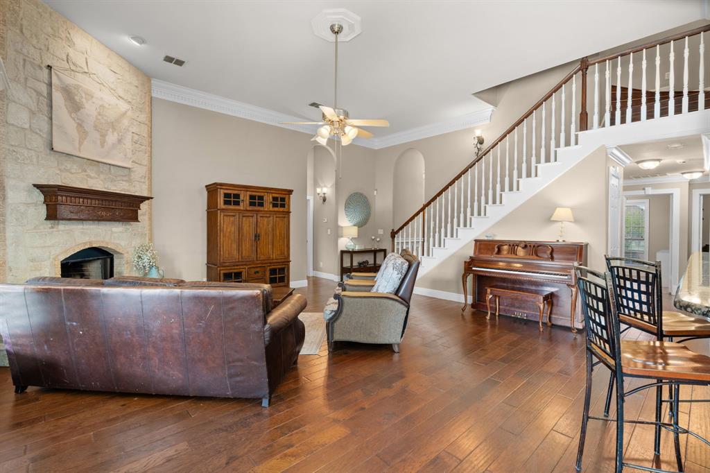 112 Waterfall Court Azle, TX 76020 - Photo 9 of 40 a living room with furniture and a fireplace