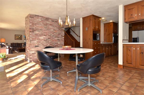 56 Baldpate Road Georgetown, MA 01833 - Photo 11 of 30 a patio with table and chairs and potted plants