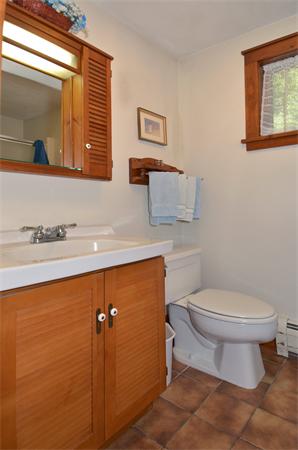 56 Baldpate Road Georgetown, MA 01833 - Photo 16 of 30 a bathroom with a toilet sink and mirror