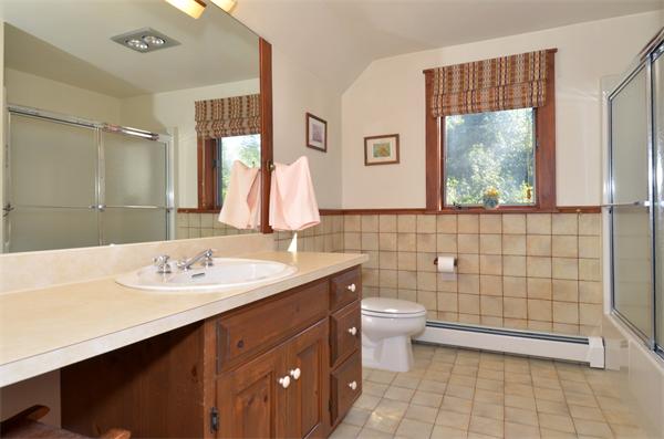 56 Baldpate Road Georgetown, MA 01833 - Photo 17 of 30 a bathroom with a double vanity sink toilet and a mirror
