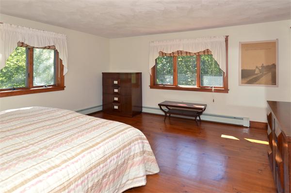 56 Baldpate Road Georgetown, MA 01833 - Photo 20 of 30 a bedroom with a bed wooden floor and window