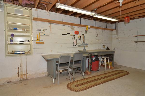 56 Baldpate Road Georgetown, MA 01833 - Photo 23 of 30 a utility room with a wooden table and chairs