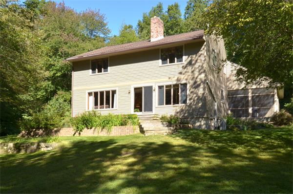 56 Baldpate Road Georgetown, MA 01833 - Photo 26 of 30 a front view of a house with a garden