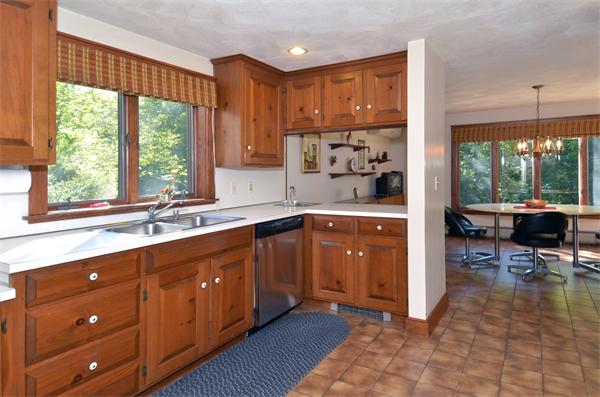 56 Baldpate Road Georgetown, MA 01833 - Photo 7 of 30 a kitchen with stainless steel appliances a sink window and cabinets