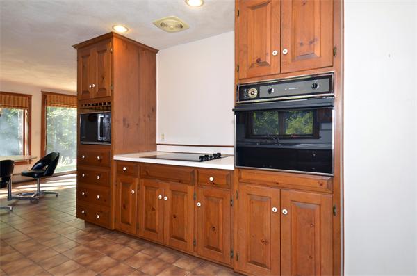 56 Baldpate Road Georgetown, MA 01833 - Photo 8 of 30 a kitchen with stainless steel appliances granite countertop a refrigerator and a stove