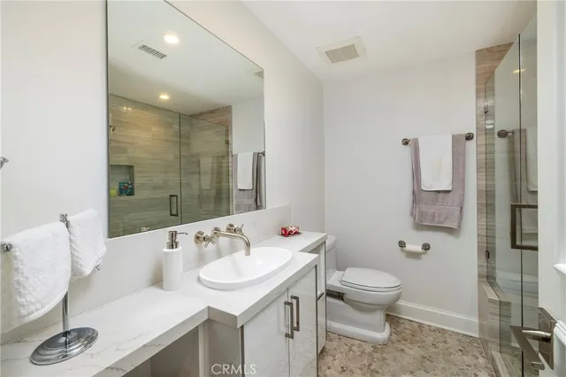 a spacious bedroom with a large bed and a couch