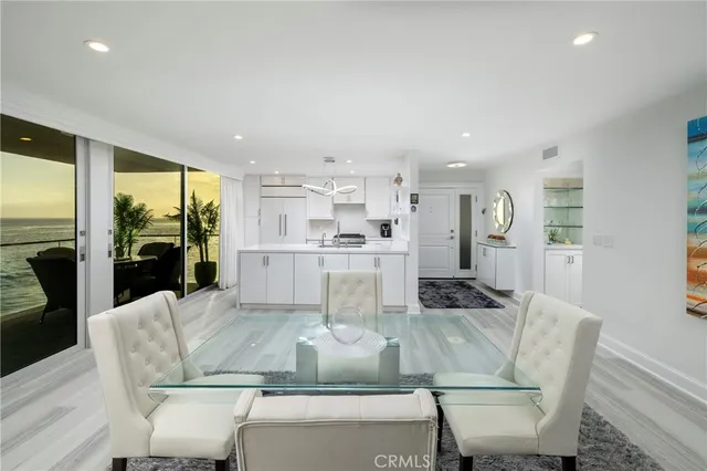 a kitchen with cabinets and stainless steel appliances