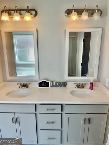 a bathroom with a glass shower door