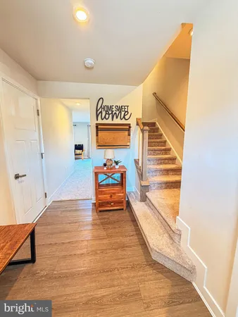 a view of an entryway with wooden floor