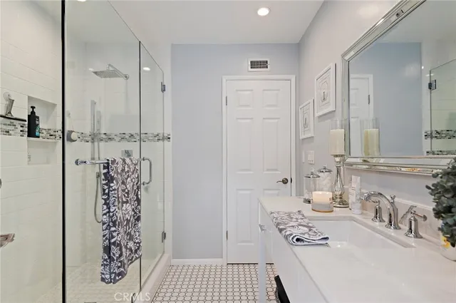 a bathroom with a bathtub and a sink