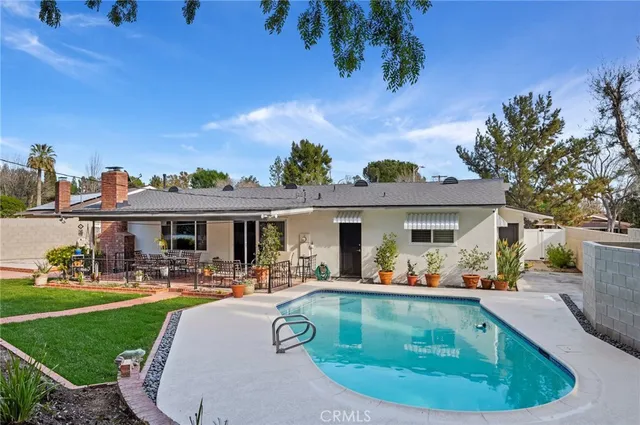 a view of a house with a swimming pool