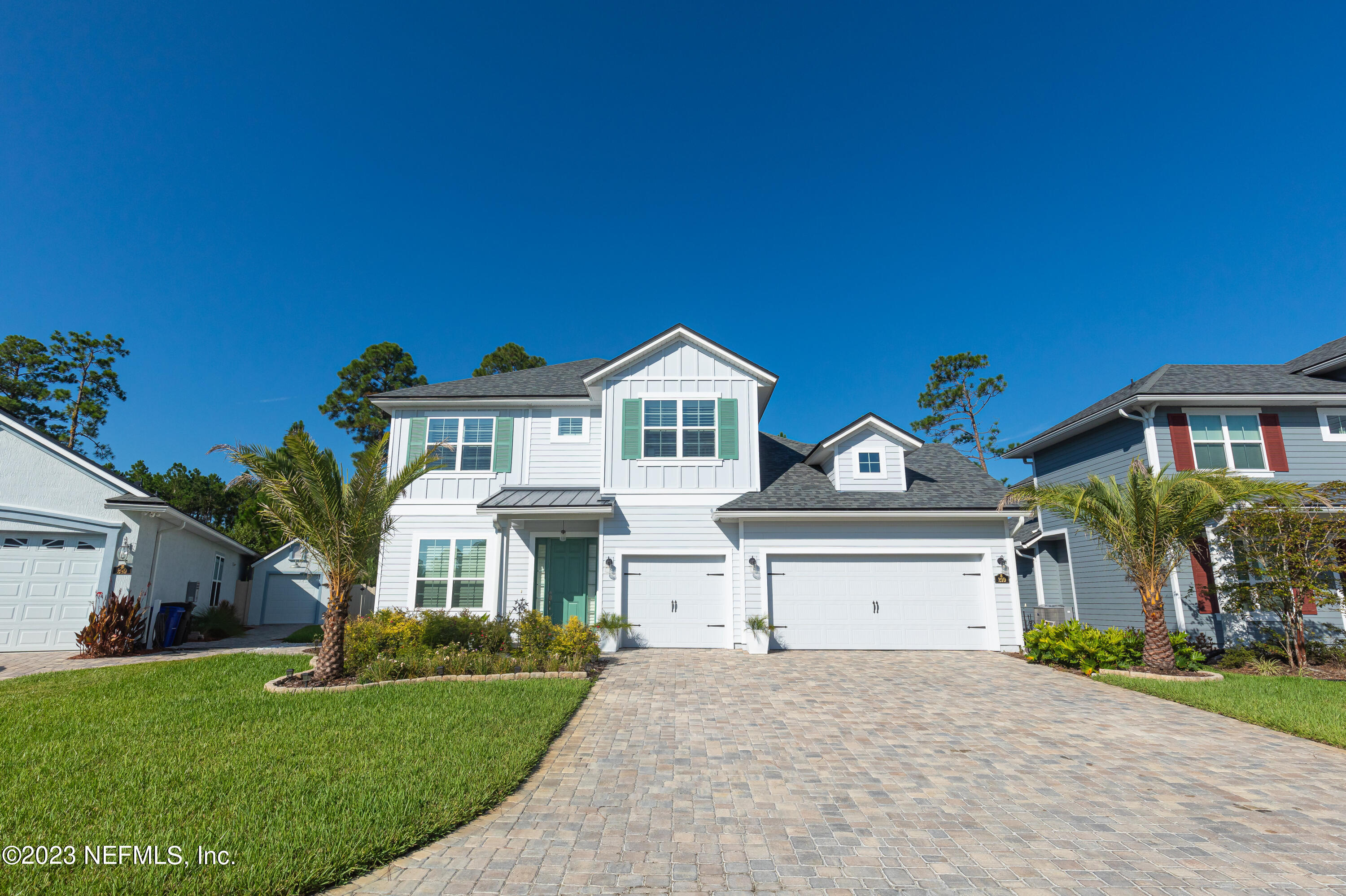 299 Tate Lane St. Johns, FL 32259 - Photo 1 of 55 a front view of a house with a yard and garage