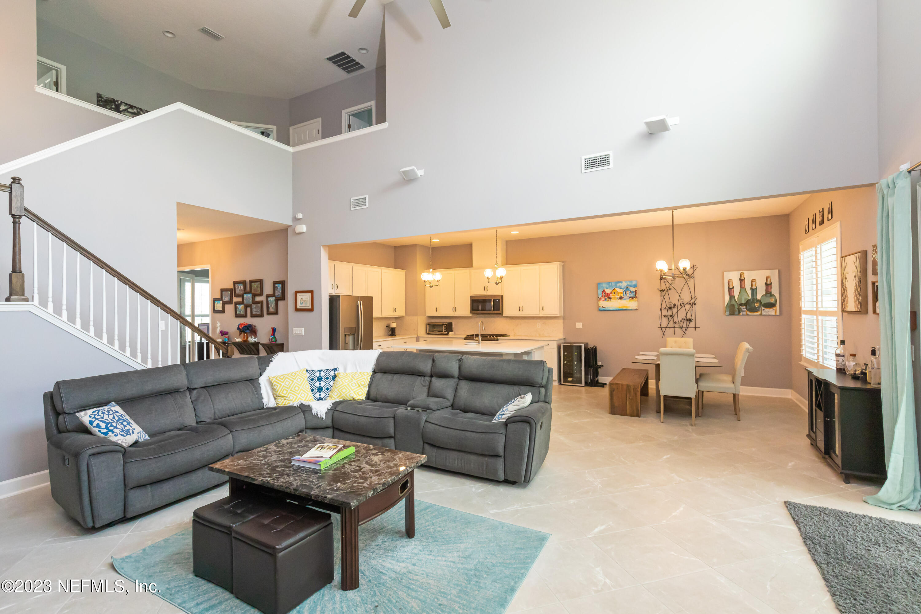 299 Tate Lane St. Johns, FL 32259 - Photo 11 of 55 a living room with furniture and a large window