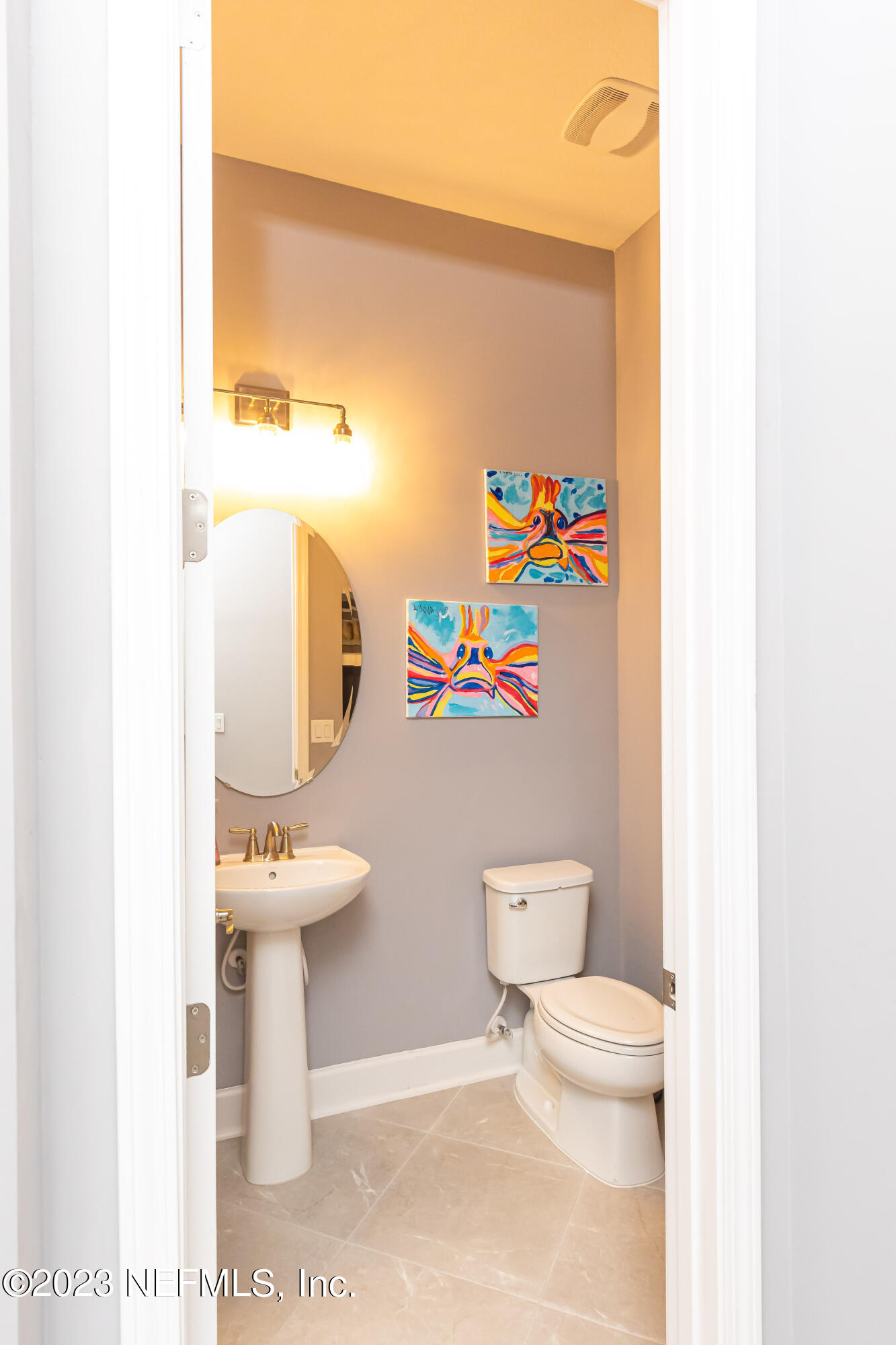 299 Tate Lane St. Johns, FL 32259 - Photo 33 of 55 a white toilet sitting next to a bathroom sink