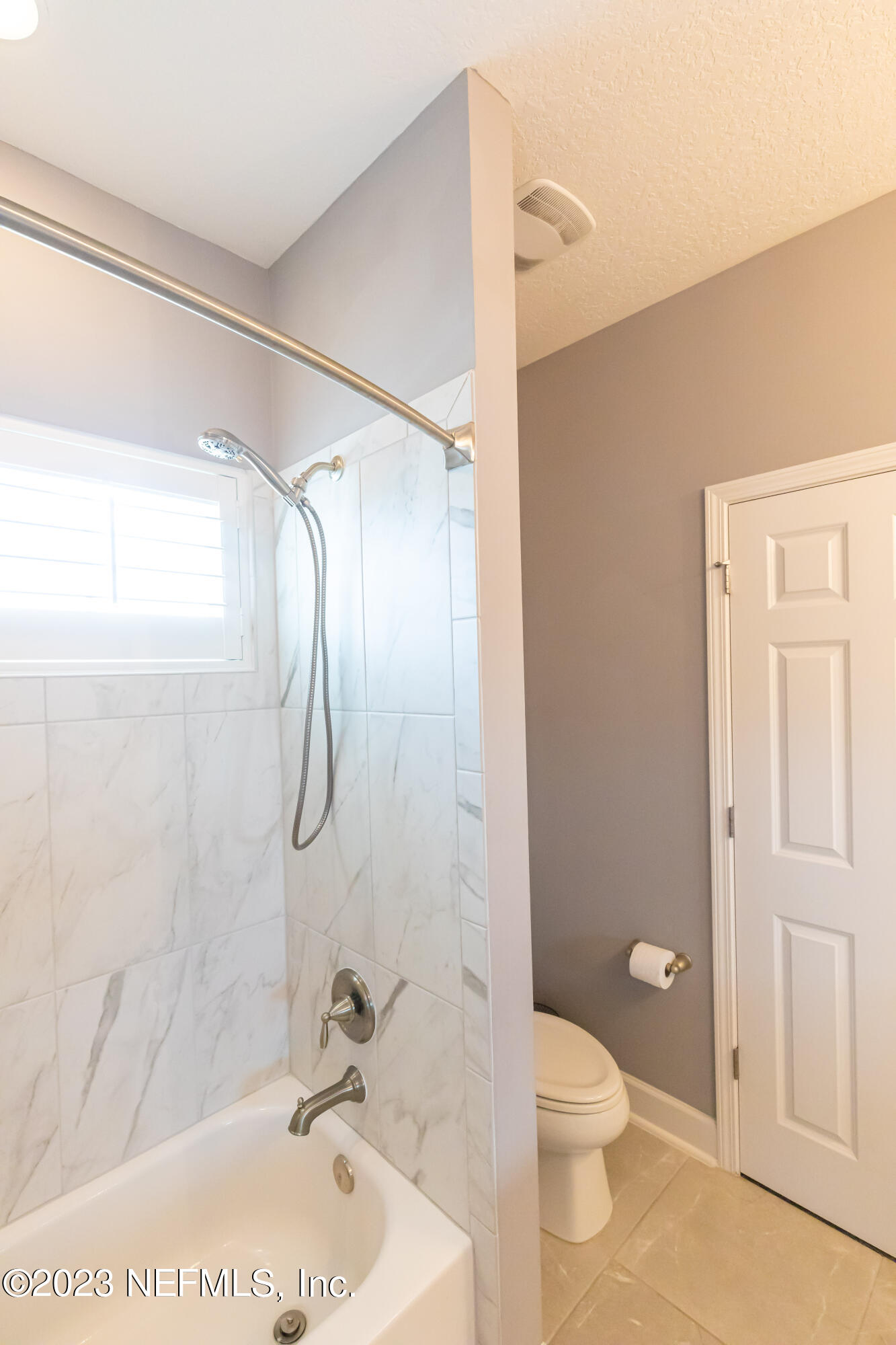 299 Tate Lane St. Johns, FL 32259 - Photo 42 of 55 a bathroom with a granite countertop sink toilet and shower