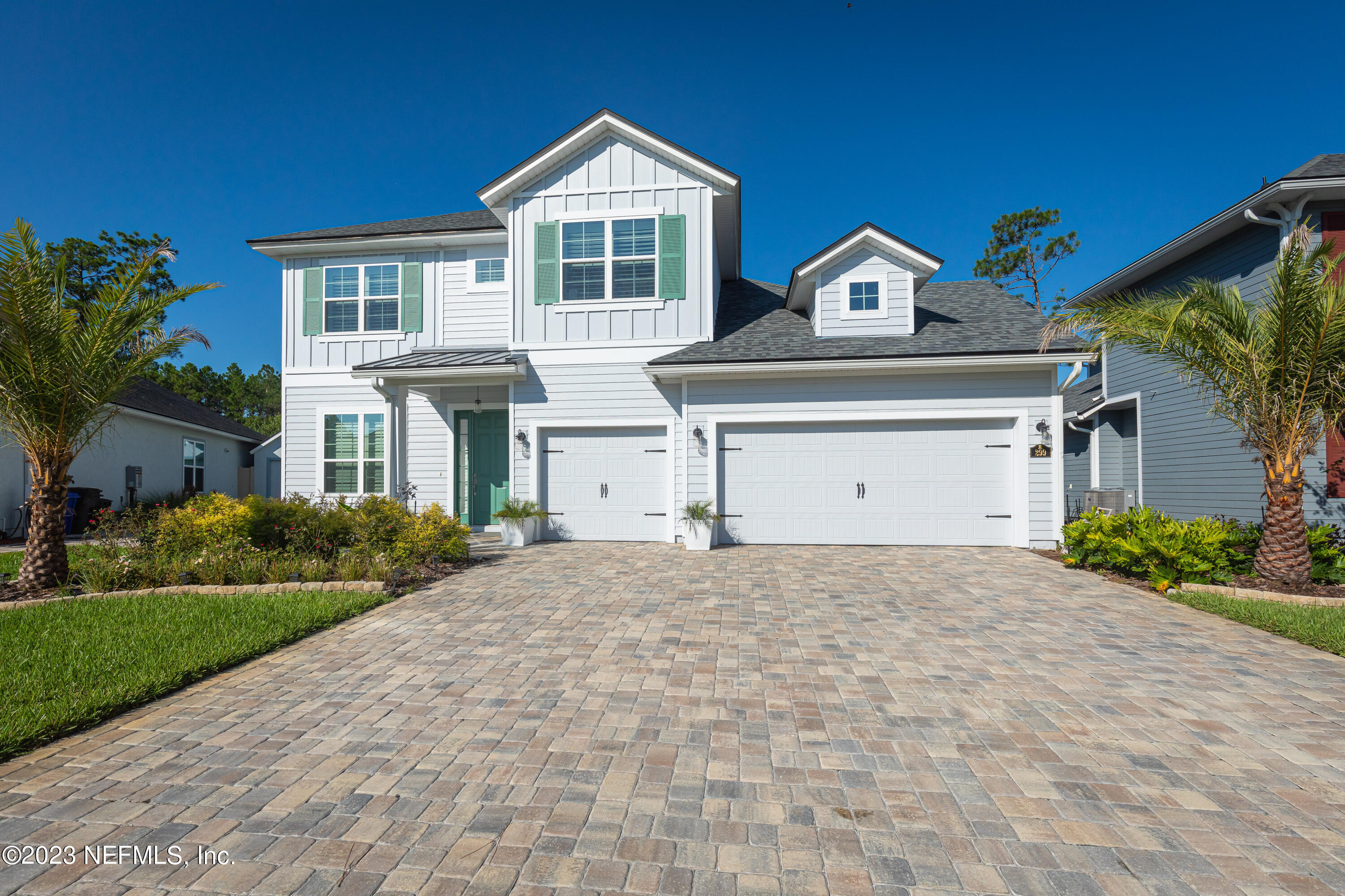 299 Tate Lane St. Johns, FL 32259 - Photo 5 of 55 a front view of a house with a yard and garage