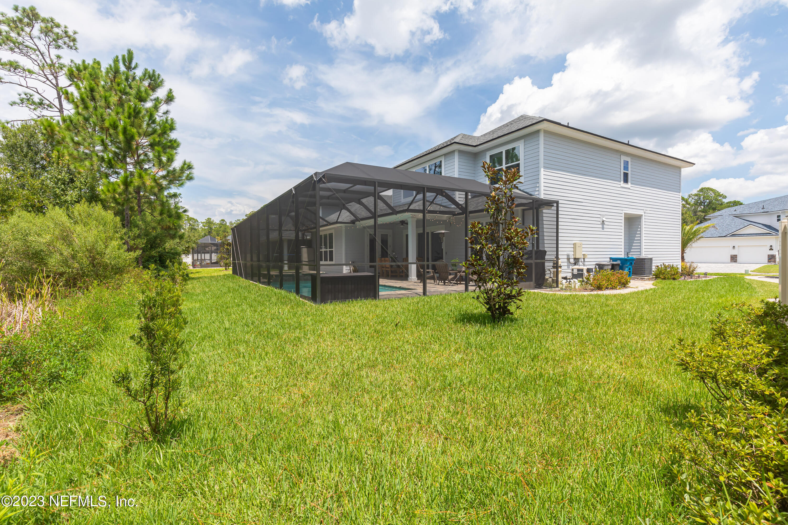 299 Tate Lane St. Johns, FL 32259 - Photo 54 of 55 a view of a house with a backyard