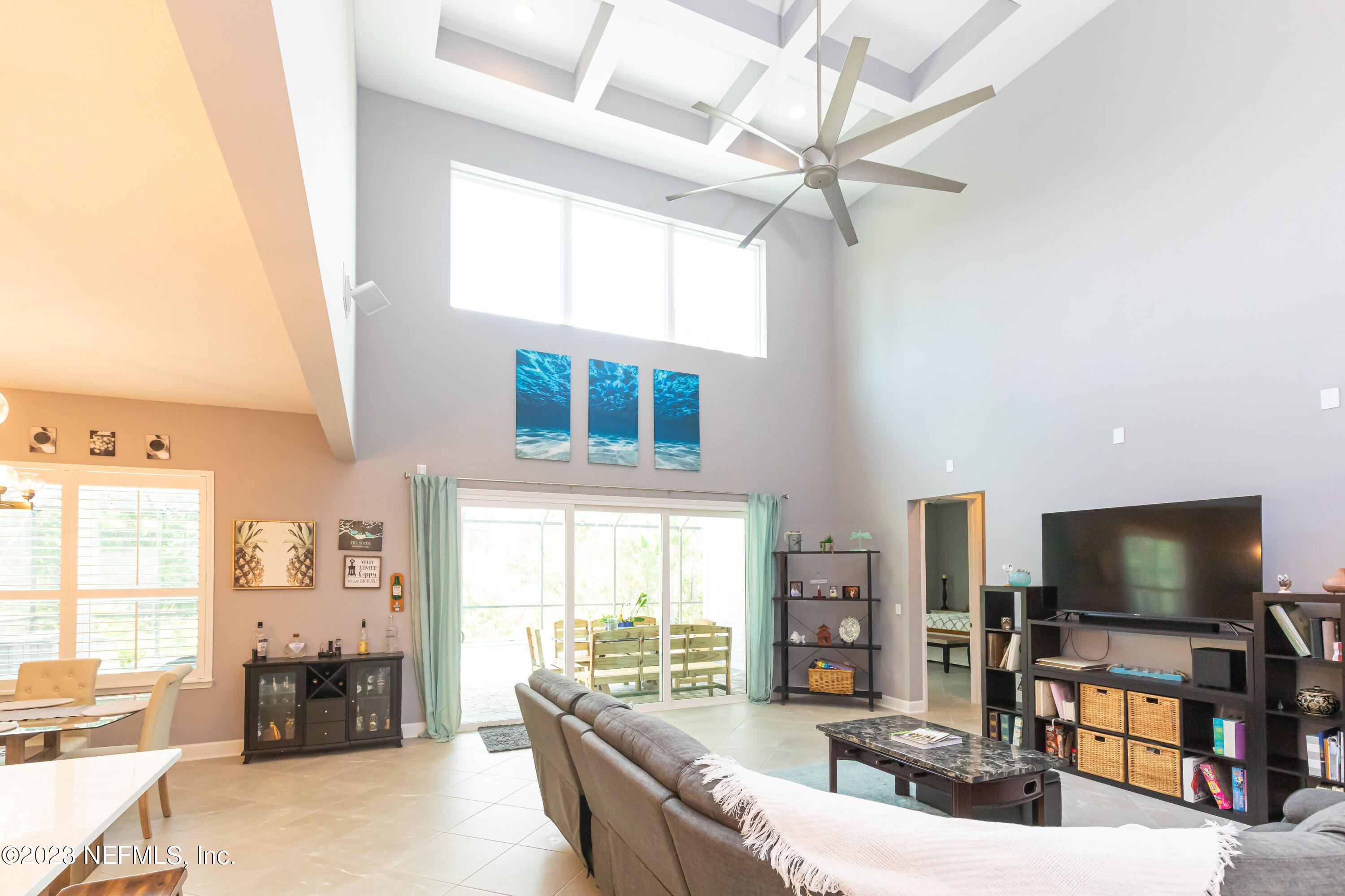 299 Tate Lane St. Johns, FL 32259 - Photo 8 of 55 a living room with fireplace furniture and a flat screen tv