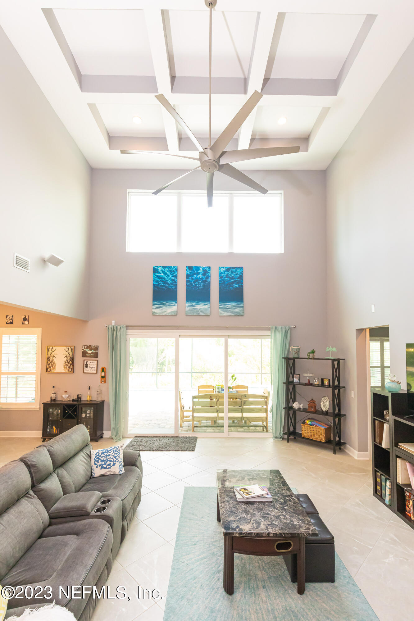 299 Tate Lane St. Johns, FL 32259 - Photo 9 of 55 a living room with furniture and a table