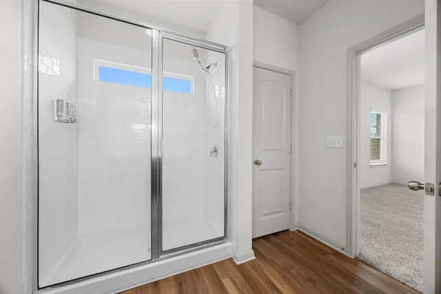 a view of bathroom with wooden floor