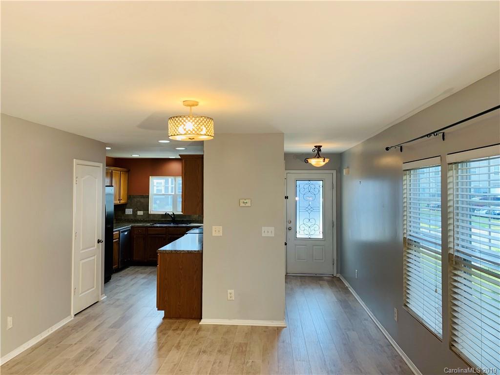 665 Potter Place Road, Unit 105 Fort Mill, SC 29708 - Photo 3 of 14 a view of a living room and hardwood floor