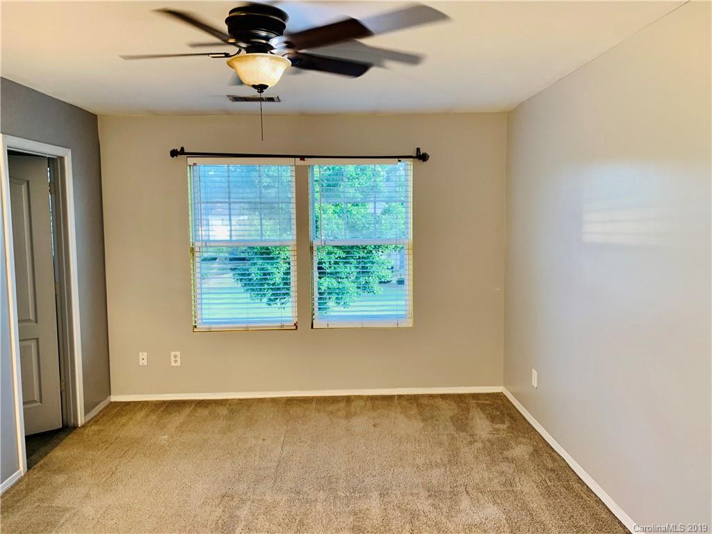 665 Potter Place Road, Unit 105 Fort Mill, SC 29708 - Photo 9 of 14 a view of an empty room and window