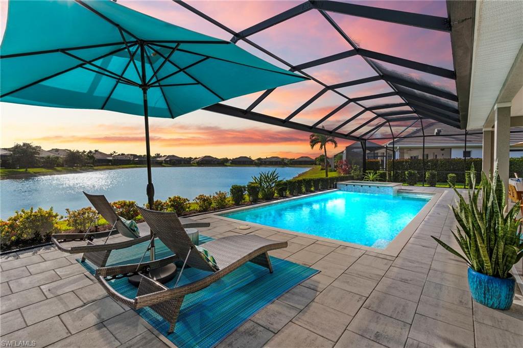 a view of a swimming pool with a lounge chairs