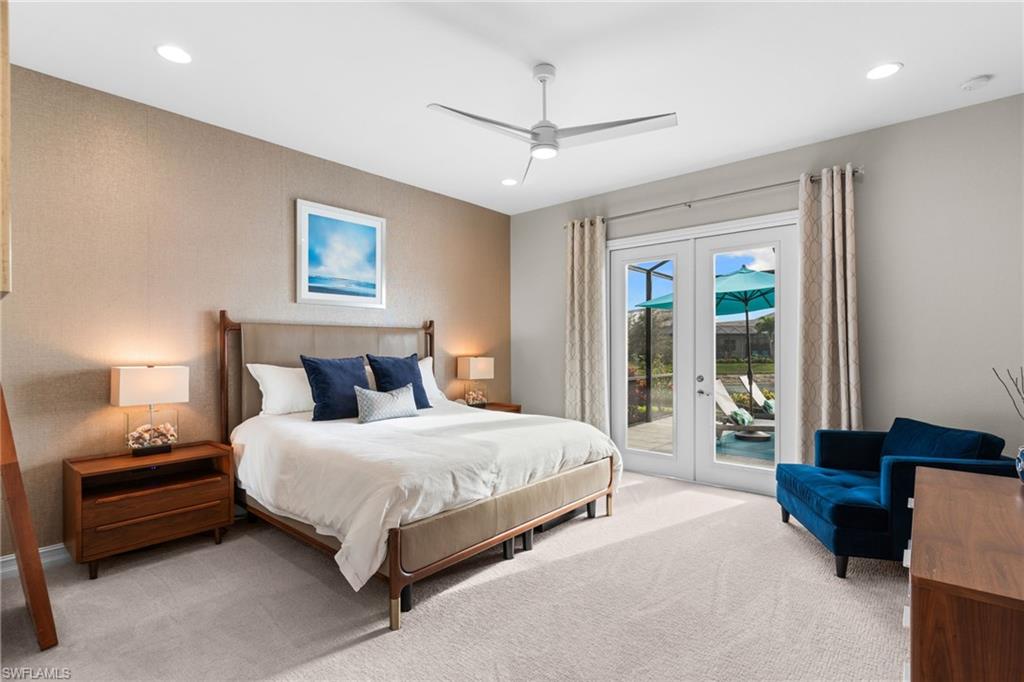 14433 Neptune Avenue Naples, FL 34114 - Photo 11 of 38 a bedroom with a bed and a couch