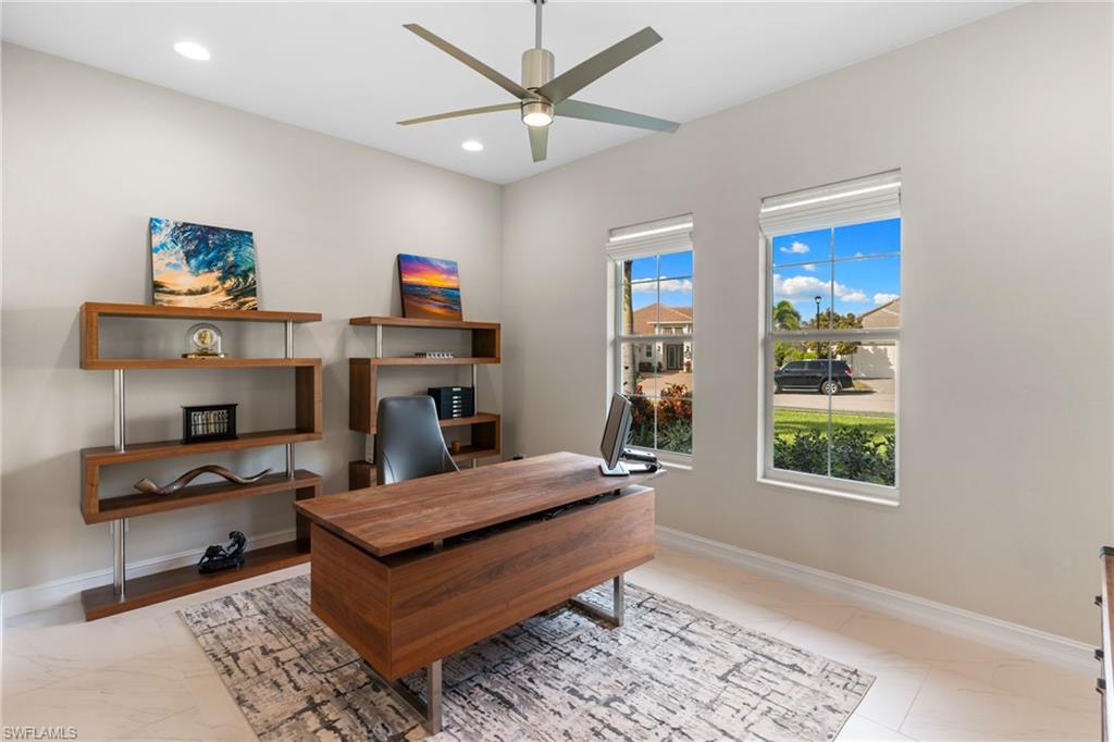 14433 Neptune Avenue Naples, FL 34114 - Photo 18 of 38 a bedroom with furniture and a window