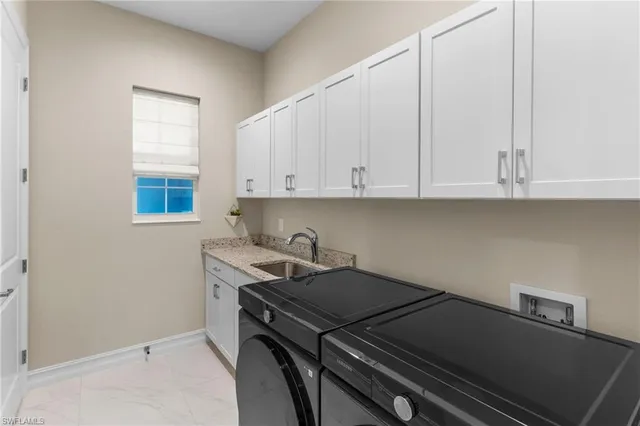 a utility room with cabinetry