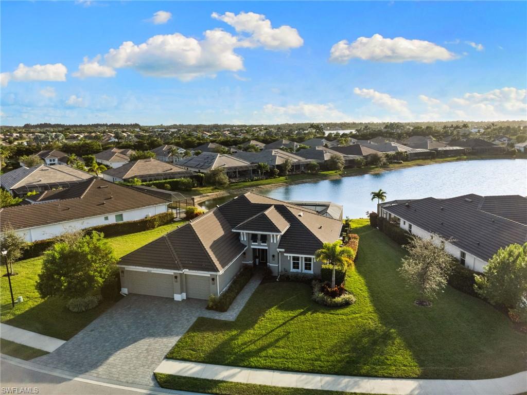 14433 Neptune Avenue Naples, FL 34114 - Photo 32 of 38 an aerial view of a house with a lake view