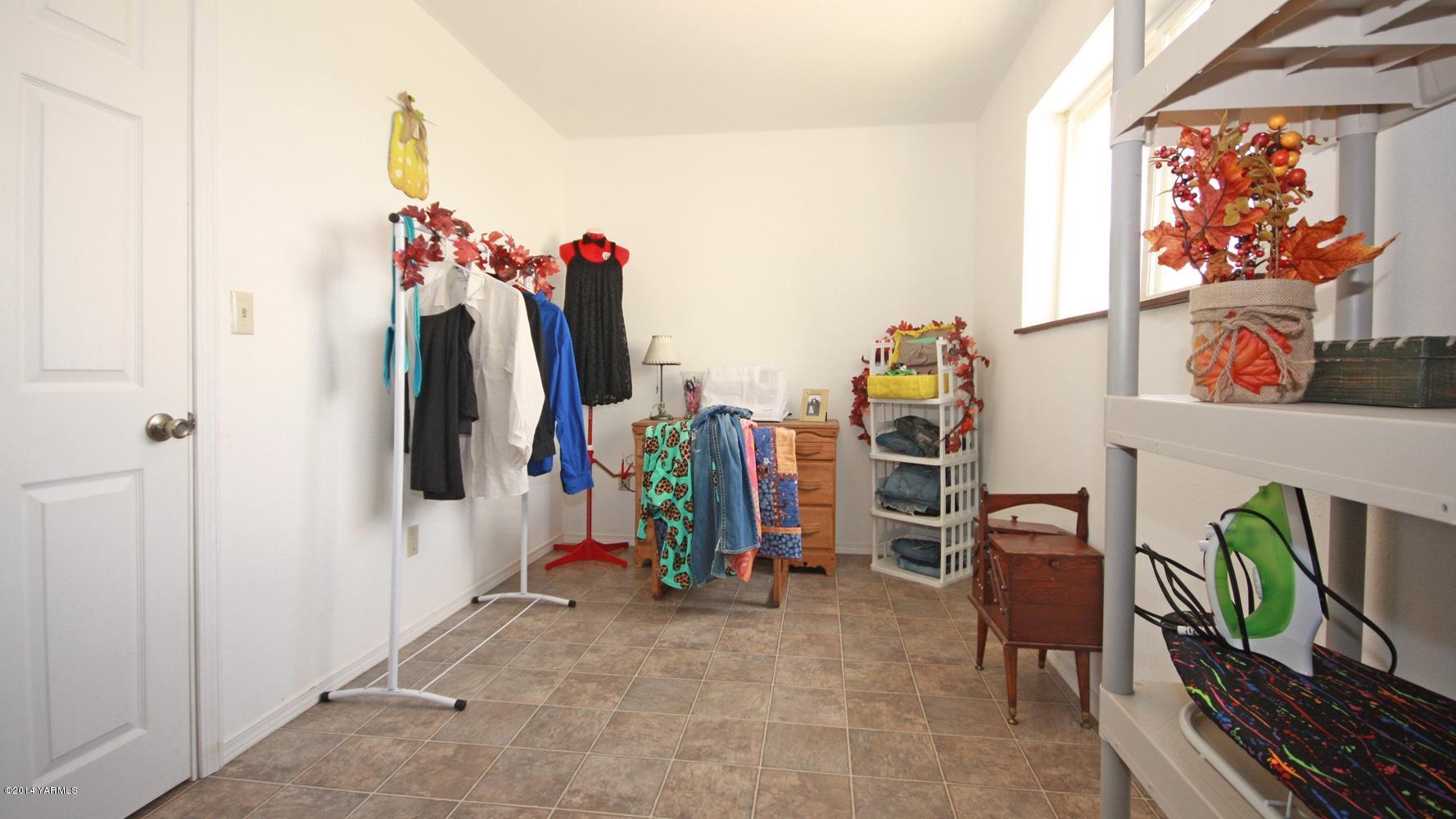 12070 Mieras Road Moxee, WA 98936 - Photo 17 of 30 a view of a closet with storage