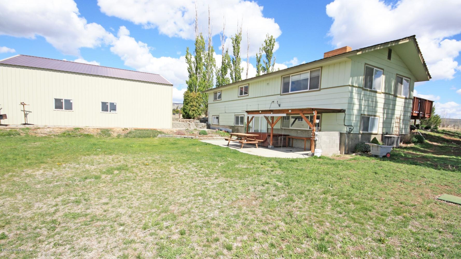 12070 Mieras Road Moxee, WA 98936 - Photo 22 of 30 a view of house with outdoor space and porch