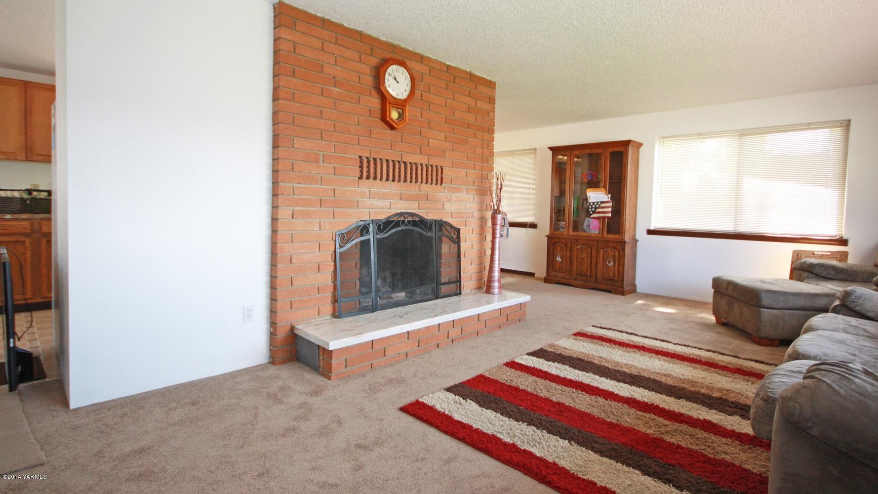 12070 Mieras Road Moxee, WA 98936 - Photo 9 of 30 a living room with furniture and a fireplace