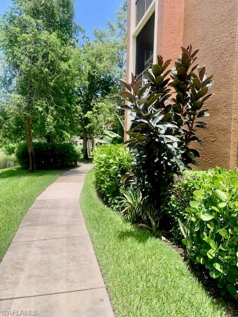 1180 Reserve Way, Unit 206 Naples, FL 34105 - Photo 14 of 22 a view of a garden