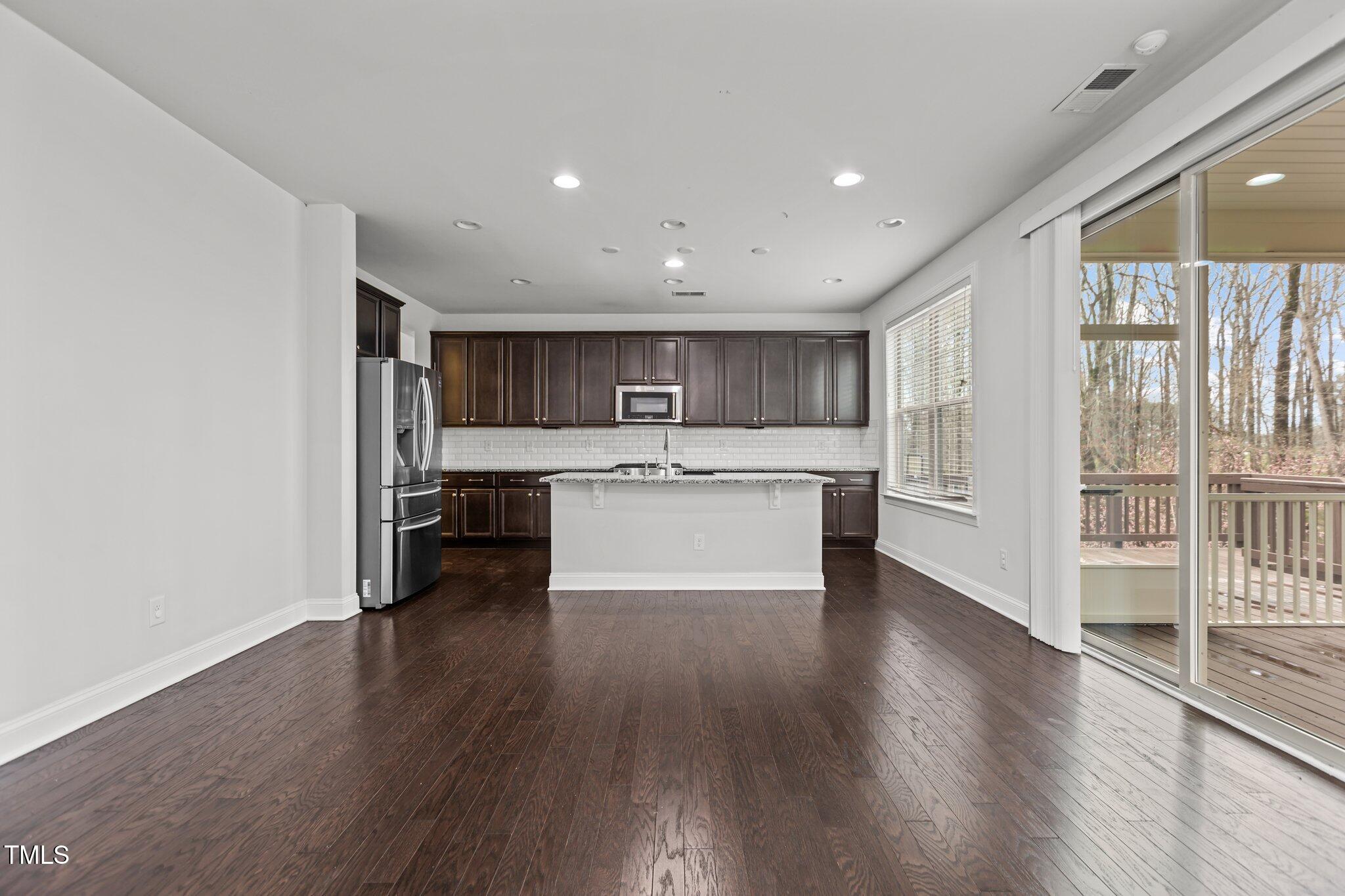 1800 Bodwin Lane Apex, NC 27502 - Photo 14 of 63 a view of kitchen with wooden floor