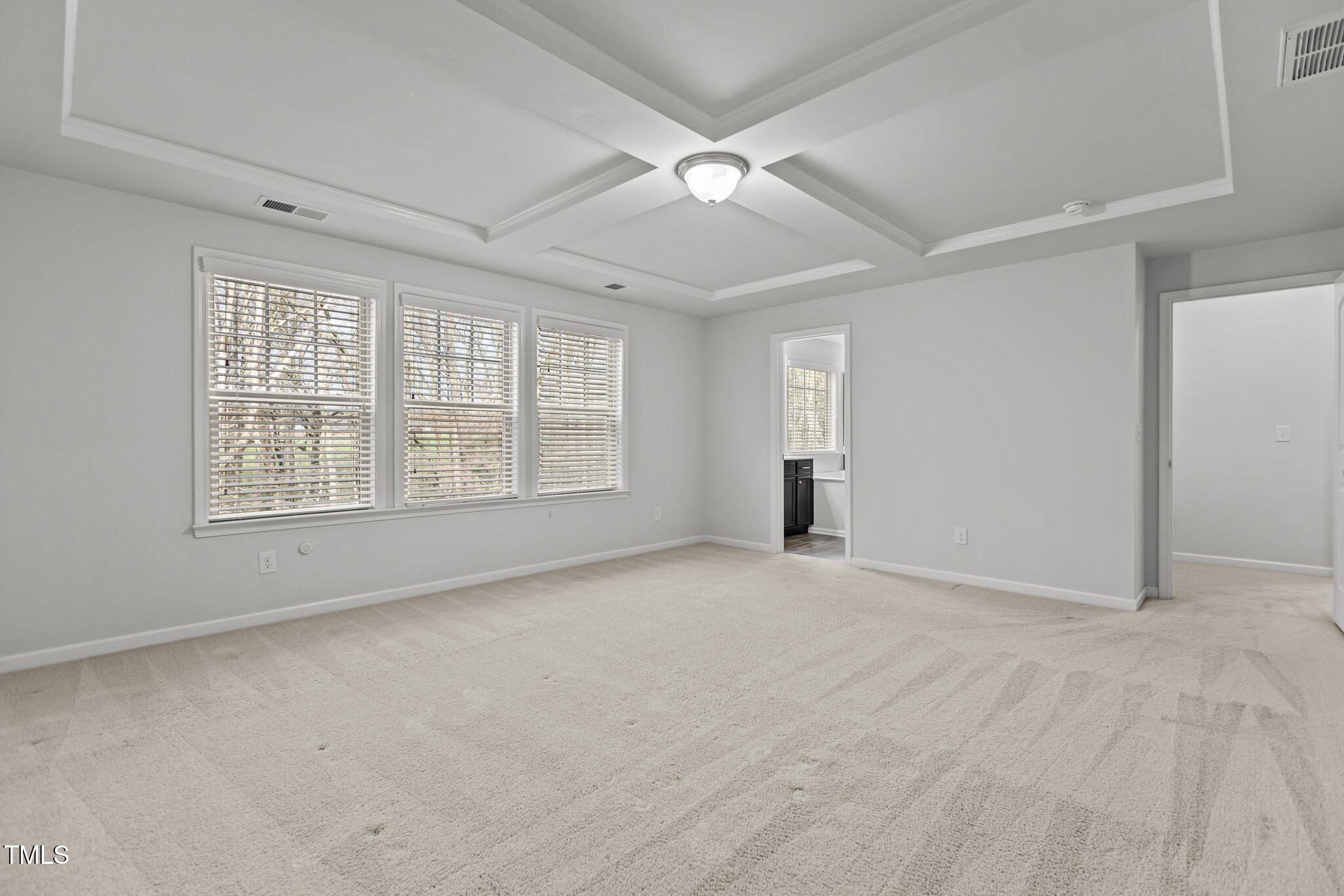 1800 Bodwin Lane Apex, NC 27502 - Photo 24 of 63 an empty room with windows and fan