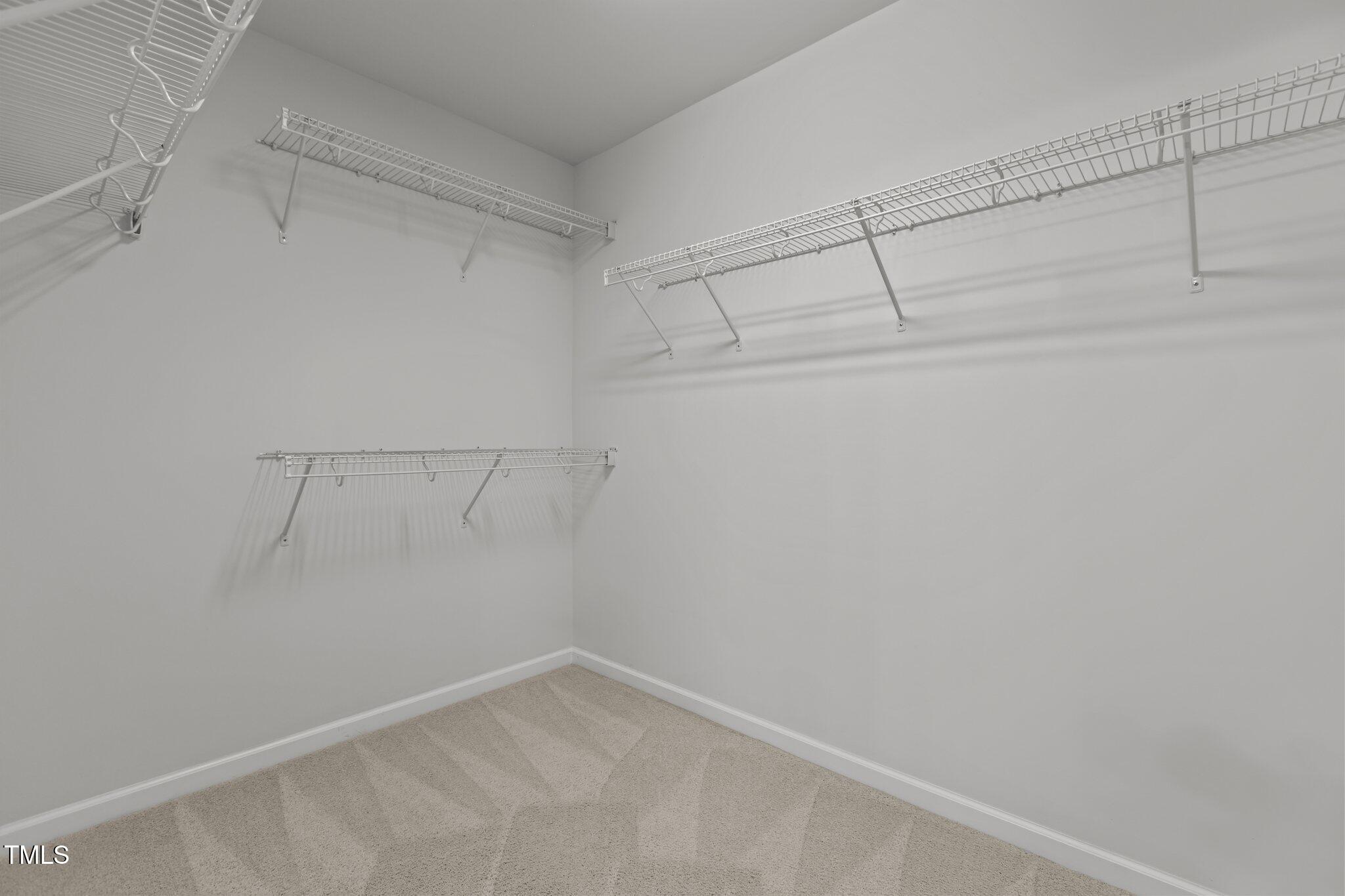 1800 Bodwin Lane Apex, NC 27502 - Photo 28 of 63 a view of a room with racks on the wall