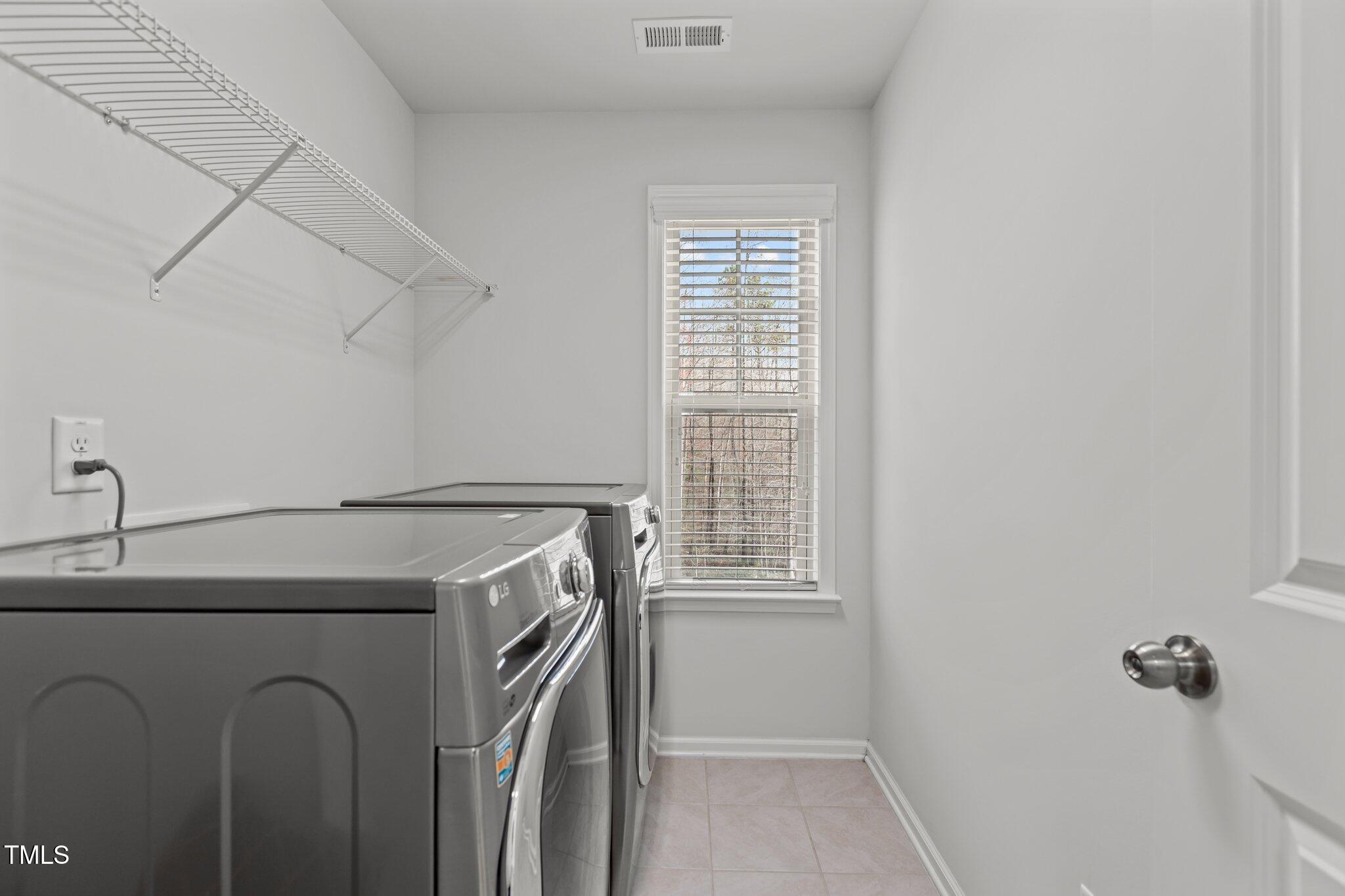 1800 Bodwin Lane Apex, NC 27502 - Photo 29 of 63 a utility room with dryer and washer