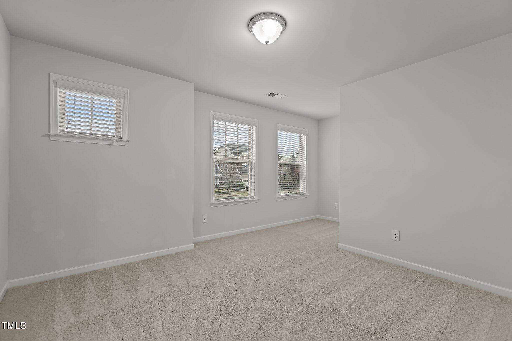 1800 Bodwin Lane Apex, NC 27502 - Photo 35 of 63 an empty room with windows