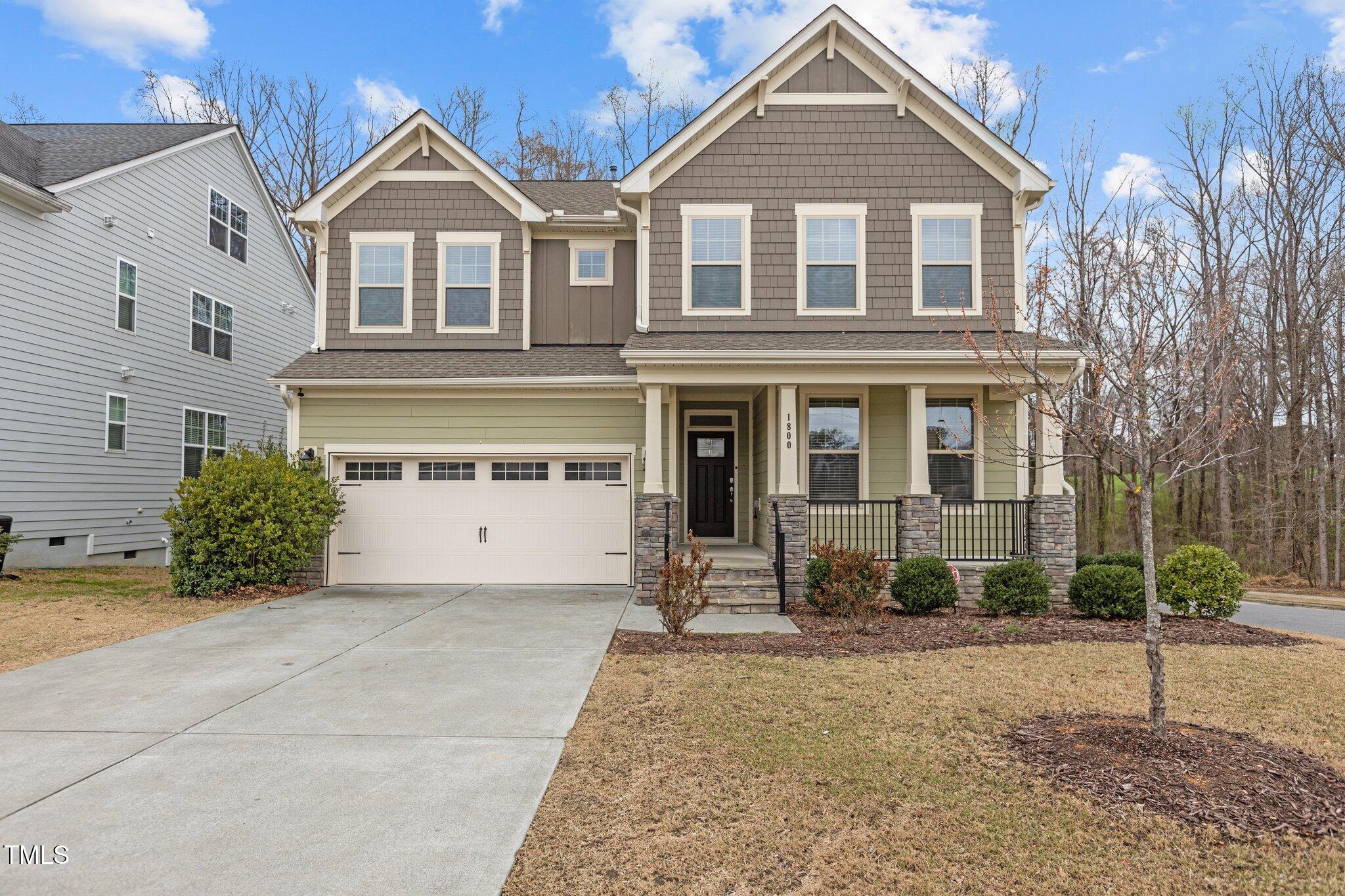 1800 Bodwin Lane Apex, NC 27502 - Photo 44 of 63 a front view of a house with garden