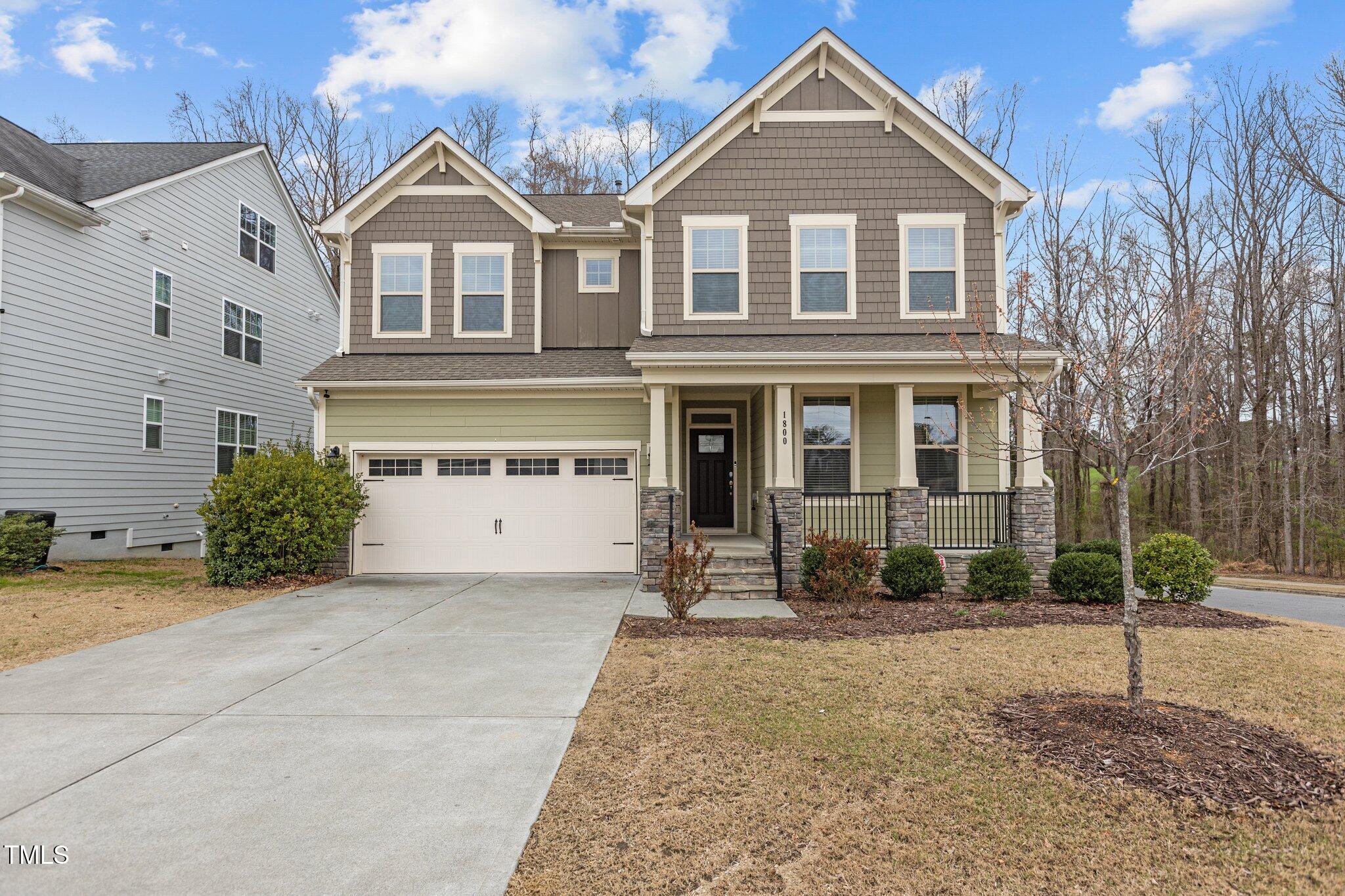 1800 Bodwin Lane Apex, NC 27502 - Photo 3 of 63 a front view of a house with a yard