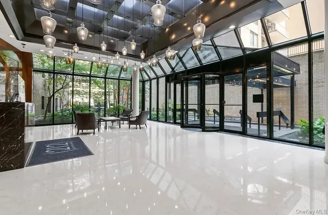 a view of a patio with a table and chairs