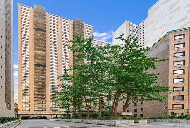 a view of a tall building from a street